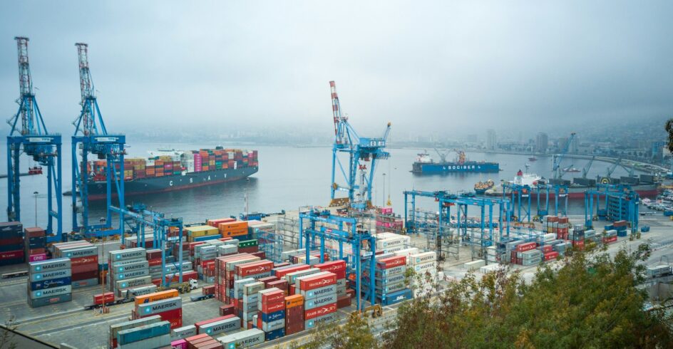 blue and red cargo ship on sea during daytime