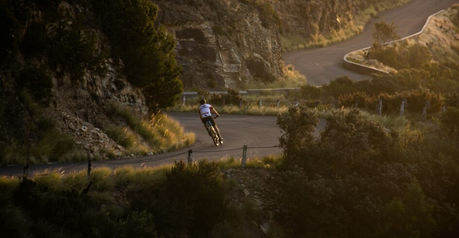 person riding bicycle on highway