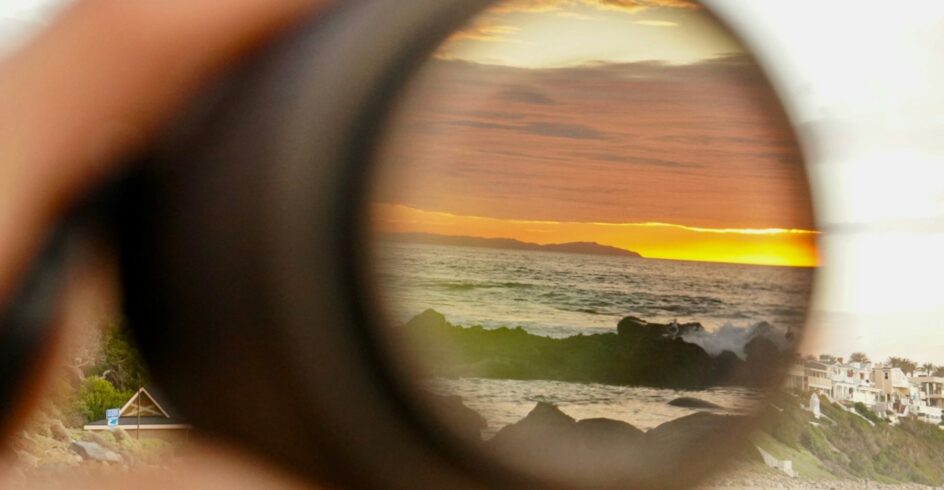 Coastal horizon in focus of a lens